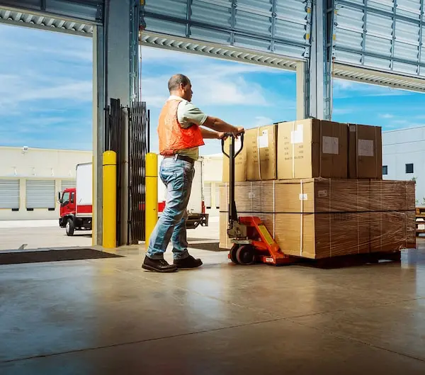 Worker loading freight.